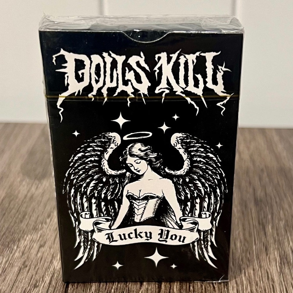 Dolls Kill playing cards & widow black nail polish.
